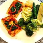 High-protein tofu pizza with vegetables and nutritional yeast
