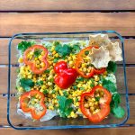 Vegan 7-layer dip with black beans, guacamole, pico de gallo, lettuce, corn and red pepper for Sukkot