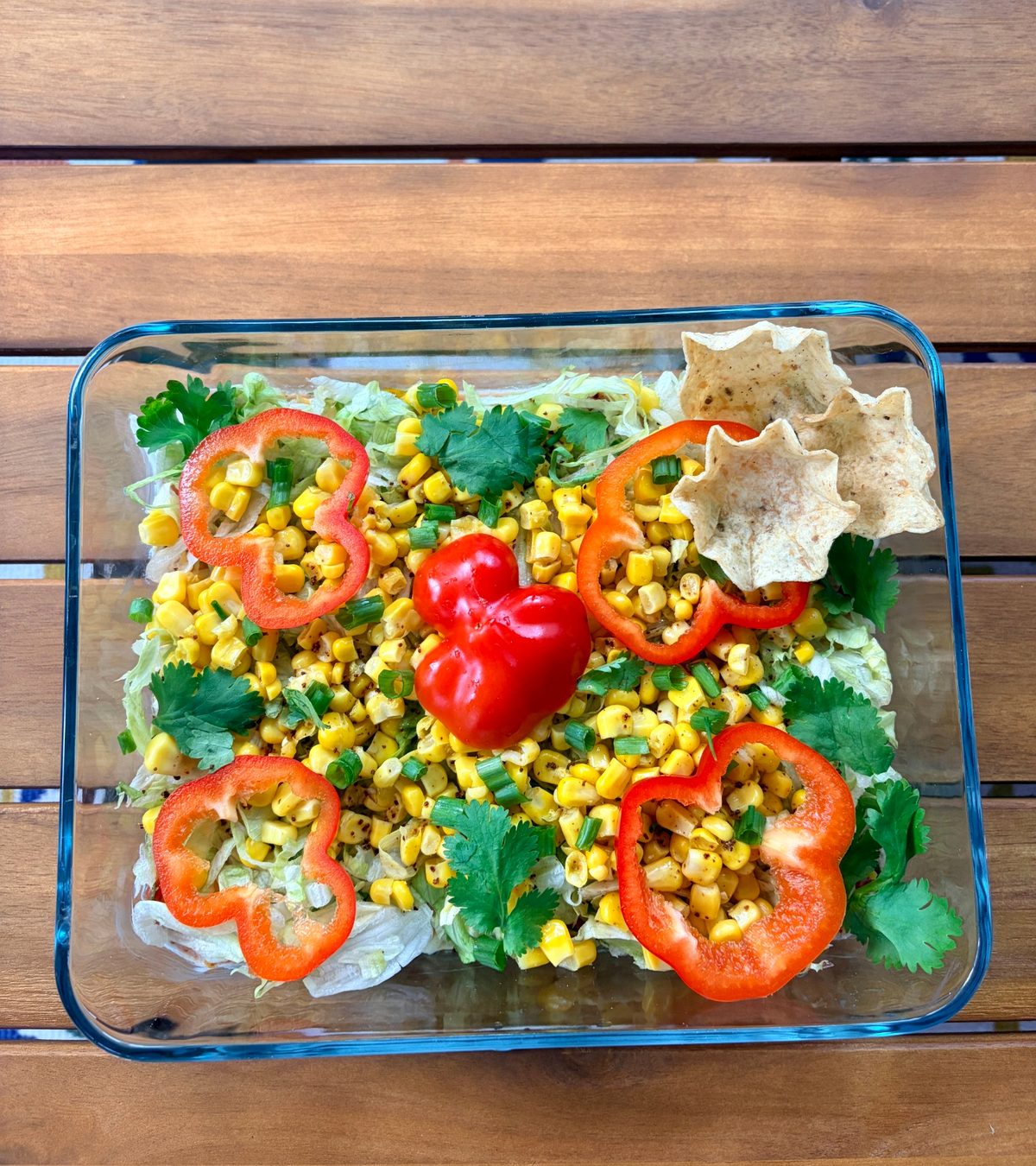 Vegan 7-layer dip with black beans, guacamole, pico de gallo, lettuce, corn and red pepper for Sukkot
